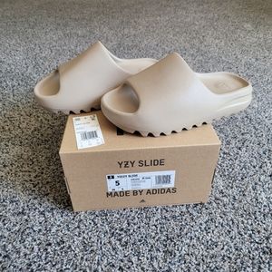 Yeezy Slides New with box.  Men's size 5, Women's size 6